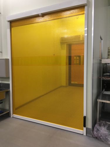 Air shower enclosure and automatic doors separate the grape processing room from the fermentation area