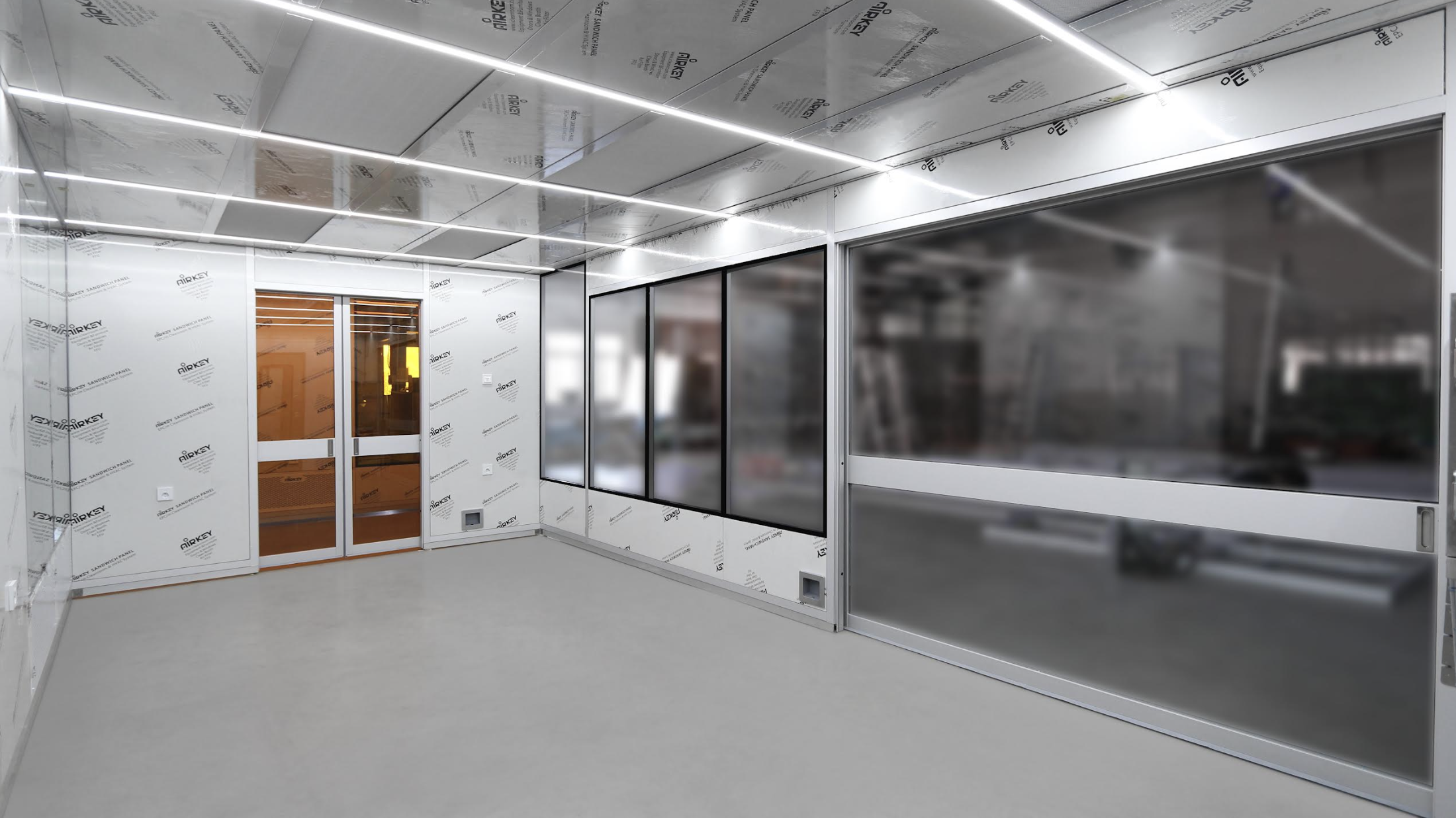 Why yellow-tinted glass walls are necessary in modular cleanrooms